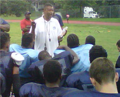Michael Carson addresses his team after a recent practice